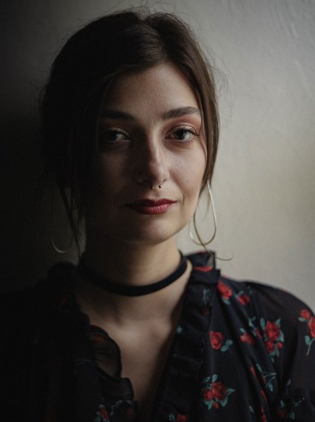 Portrait of a young woman with Rembrandt lighting
