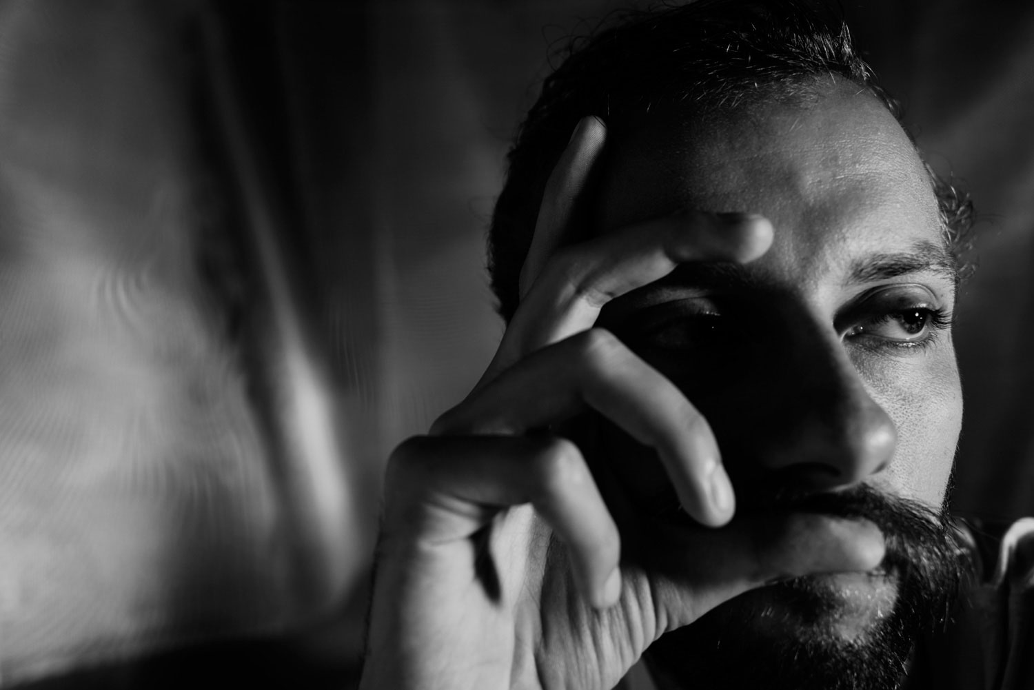 portrait of a man thinking with moody Rembrandt lighting